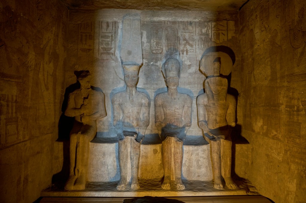 Ancient Egyptian gods Ptah, Amun, Ra and the Pharoah Ramses II in the inner most chamber at Abu Simbel Temple