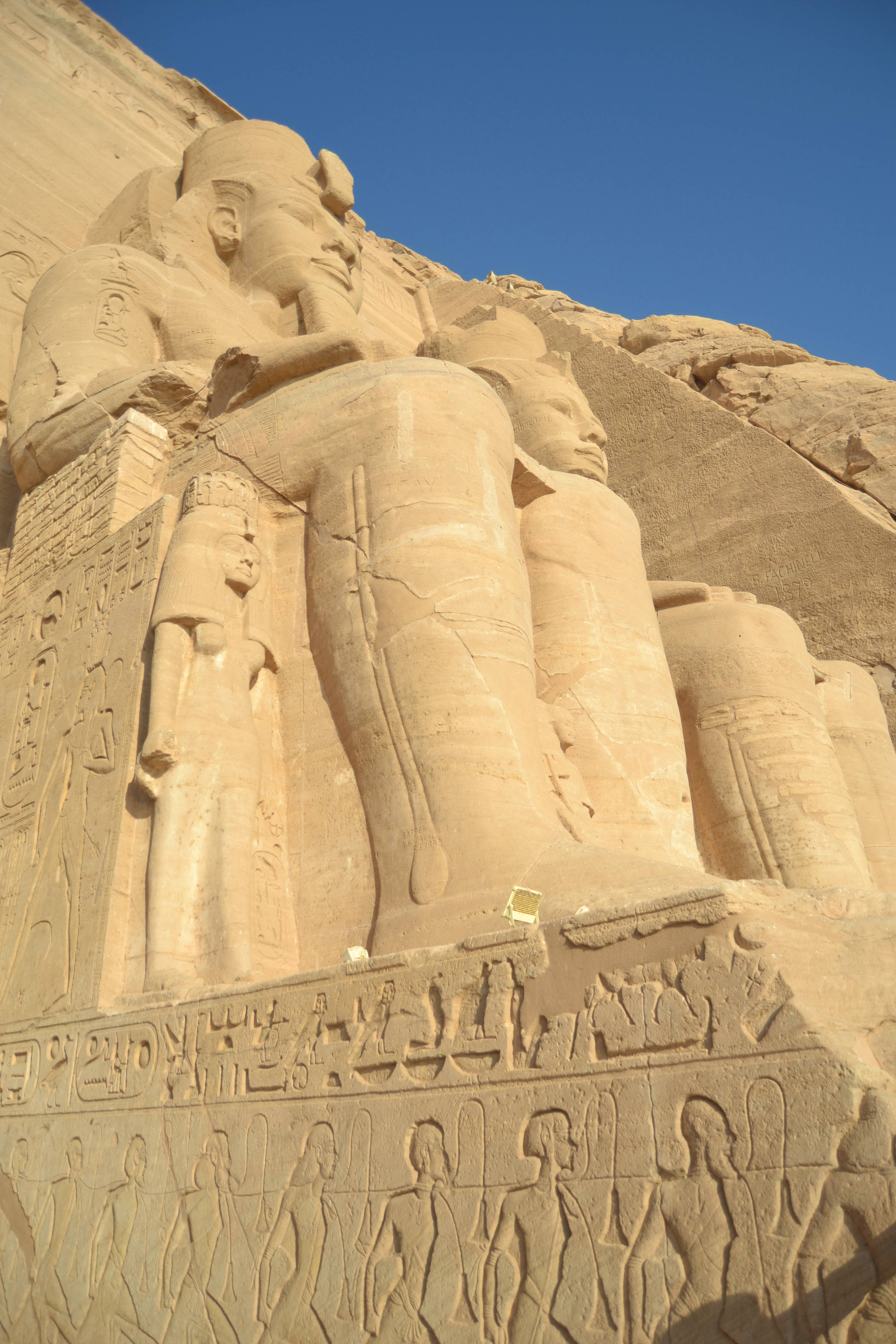 Abu Simbel statues - the statues of Ramses II with smaller statues of his children at his feet